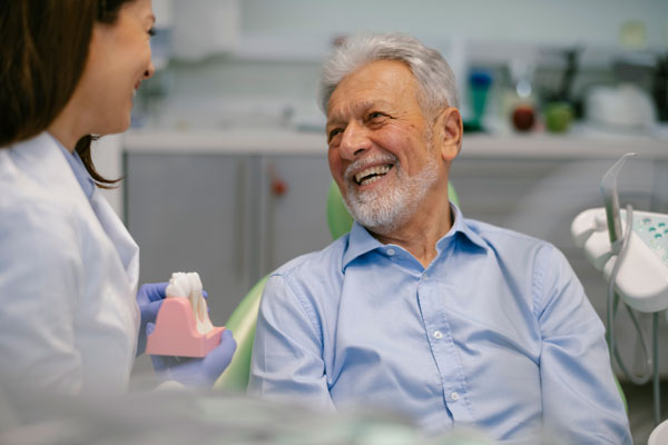 a smiling older dental patient