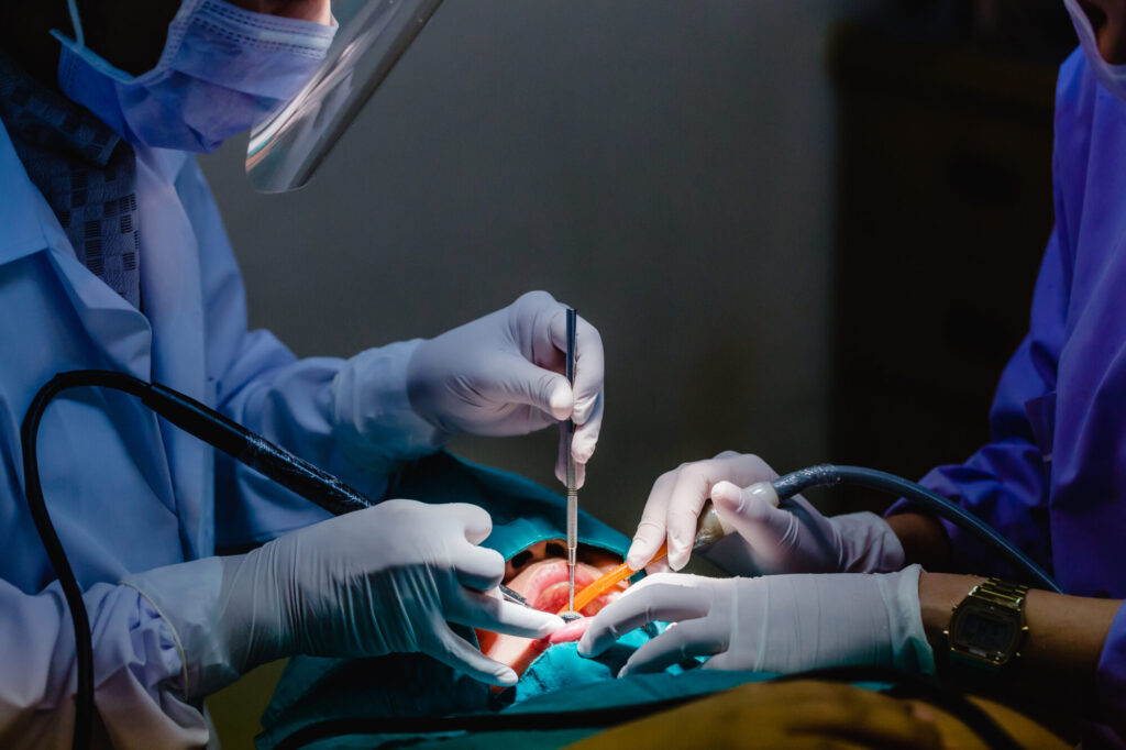 Dentist common operation of cleaning boy mouth.